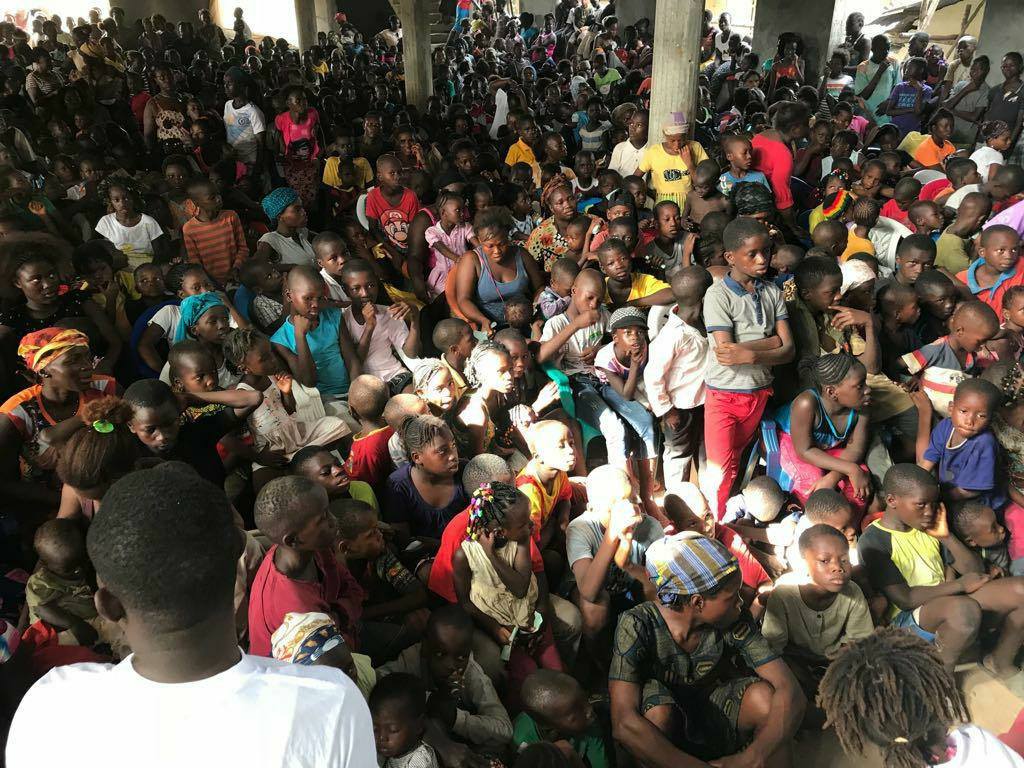 Massive numbers of orphans waiting for food at the TOFF orphan feed in Sierra Leone, 2018.