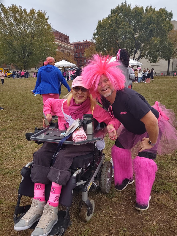 Sheri posing with a “well-dressed” walker at the annual Making Strides Against Breast Cancer Walk, 10-19.