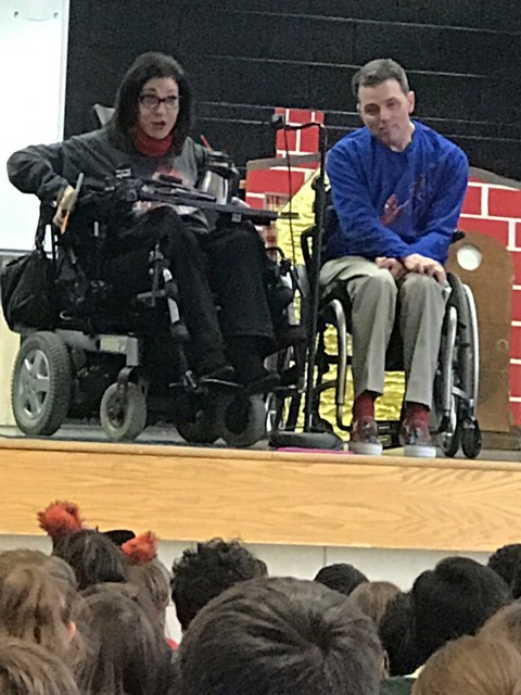 Happy on Wheels speaking to and answering questions from students at Glebe Elementary in Arlington, about life when using a wheelchair, 3-19.