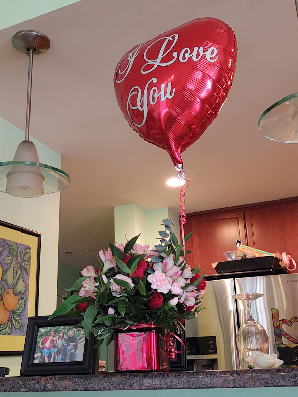 A beautiful bouquet of flowers and a balloon from my Valentine, Tony, 2-21.