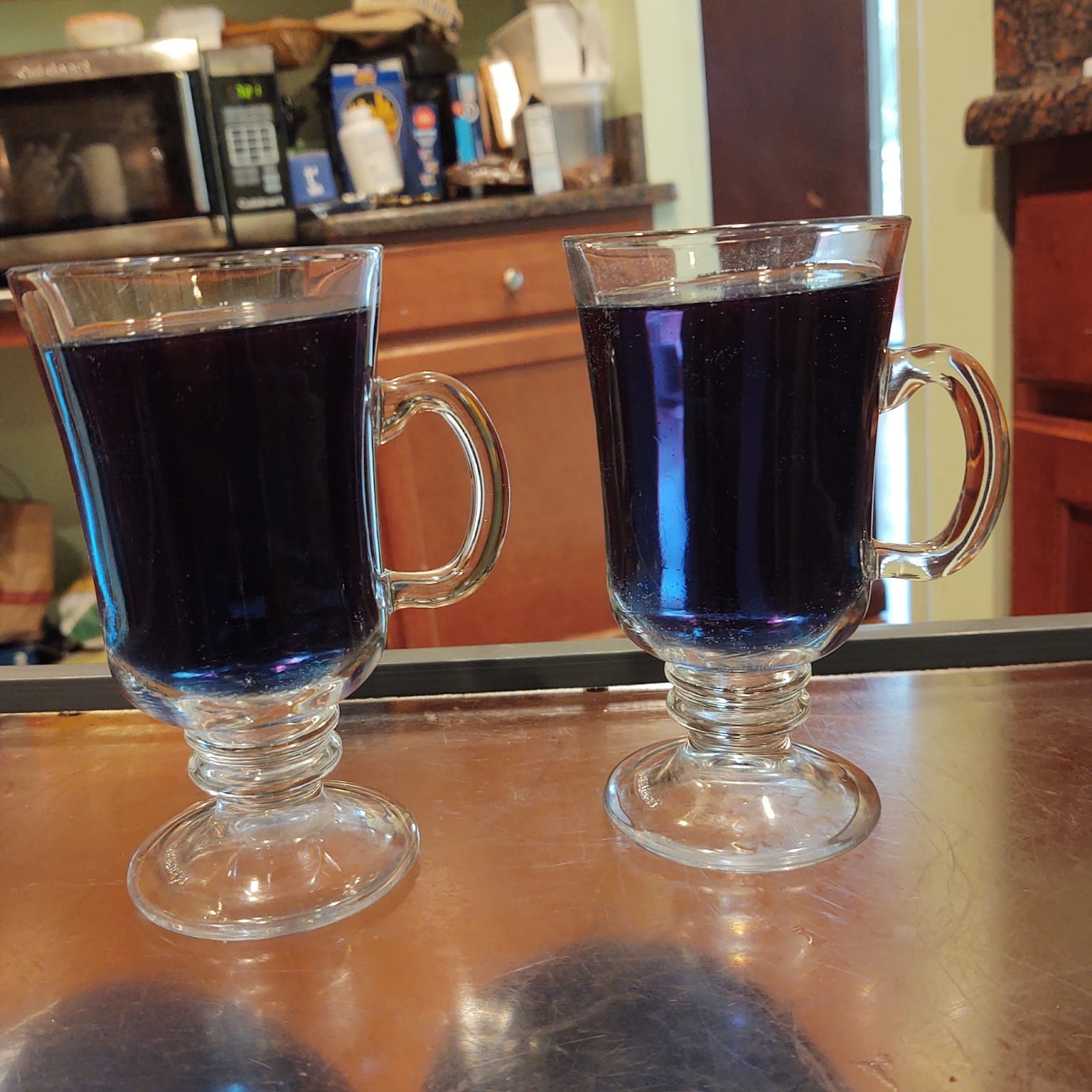 Trying butterfly pea flower tea in our "fancy" latte glasses, gorgeous blue color (turns purple if you add lemon juice), 7-21.