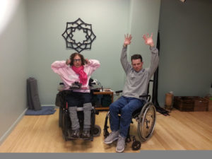 Wheelchair users doing yoga.