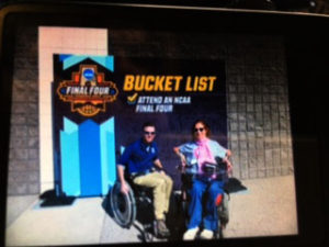 Happy on Wheels under a Bucket List sign