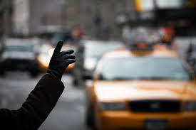 Photo of someone hailing a taxi