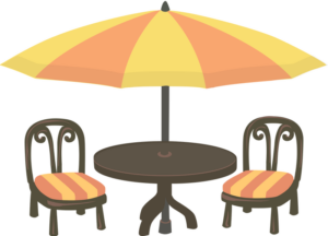 Outdoor cafe table with an umbrella and two empty chairs.