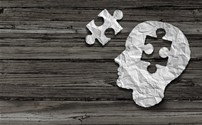 Picture of a person's head wuth a puzzle piece missing and nthe puzzle piece is next to the head.