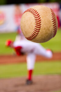 Baseball pitcher throwing a pitch.