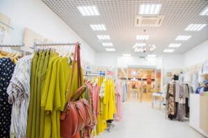 Racks of clothes in a fashion boutique.