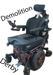 A photo of Sheri's wheelchair with the words Demolition Derby around it.