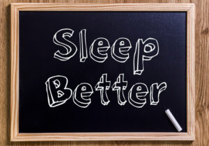 Chalkboard with 3D outlined text that says Sleep Better.