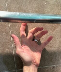 A hand that just can't reach a grab-bar.